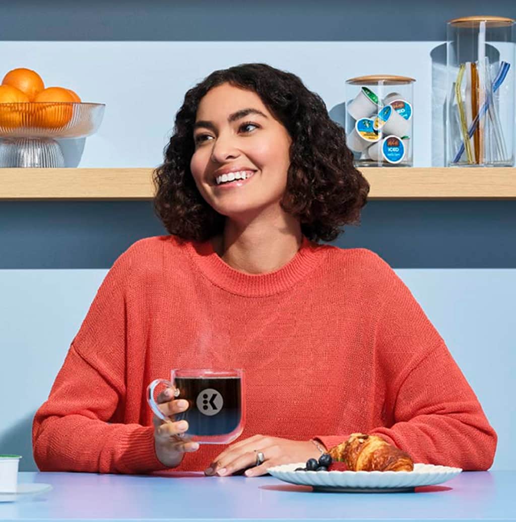 woman drinking coffee looking forward to savings