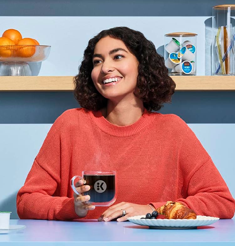 woman drinking coffee looking forward to savings